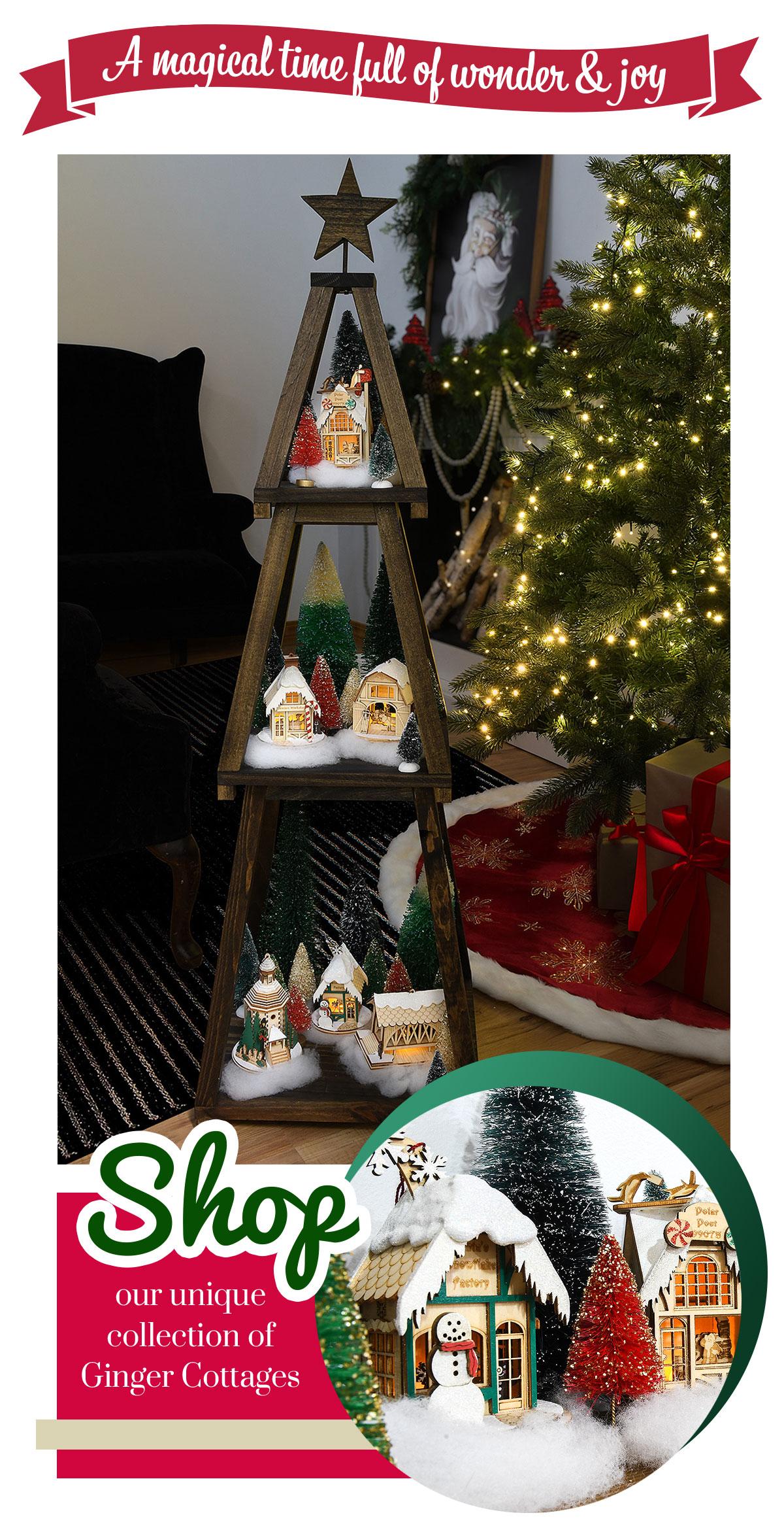 Shop our unique collection of Ginger Cottages | A magical time full of wonder and joy | Ginger cottages displayed on a wooden Christmas tree shaped shelf