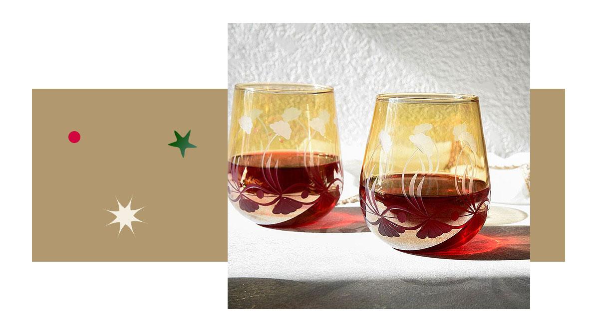 Mustard Colored Stemless Egyptian Glass Museum Wine Glass Tumbler filled with a nice red wine