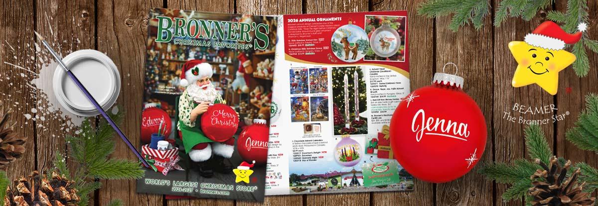 Click to Sign Up for Bronner's Mailing List Bronner's Christmas Favorites 2026-2027 Catalog featuring a painting Santa. Next to it is a paint jar, paint brush, and a red personalized painted ornament.