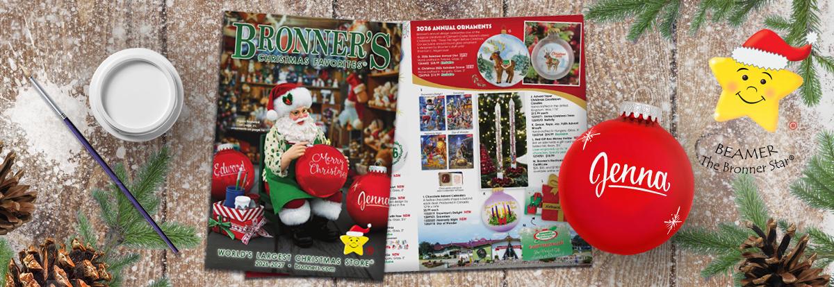 Click to Sign Up for Bronner's Mailing List Bronner's Christmas Favorites 2026-2027 Catalog featuring a painting Santa. Next to it is a paint jar, paint brush, and a red personalized painted ornament.