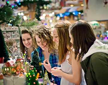 Customers admiring a Dept. 56 village.